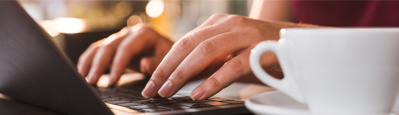 hands typing on a laptop