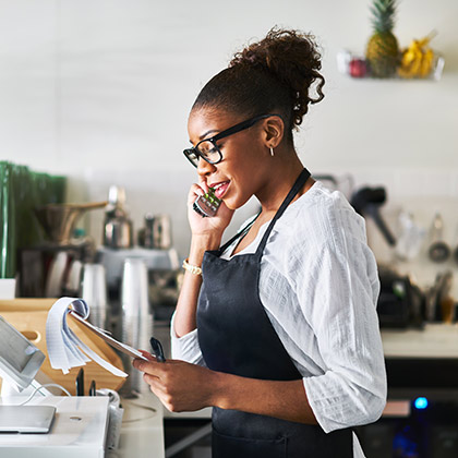 Woman working at cafe.